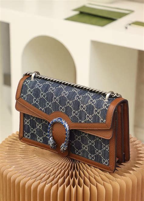 dionysus gucci clutch|gucci dionysus denim bag.